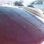 Before and after photographs of a damaged Porsche that was repaired by Elite Paint & Body Shop in West Palm Beach, Florida.